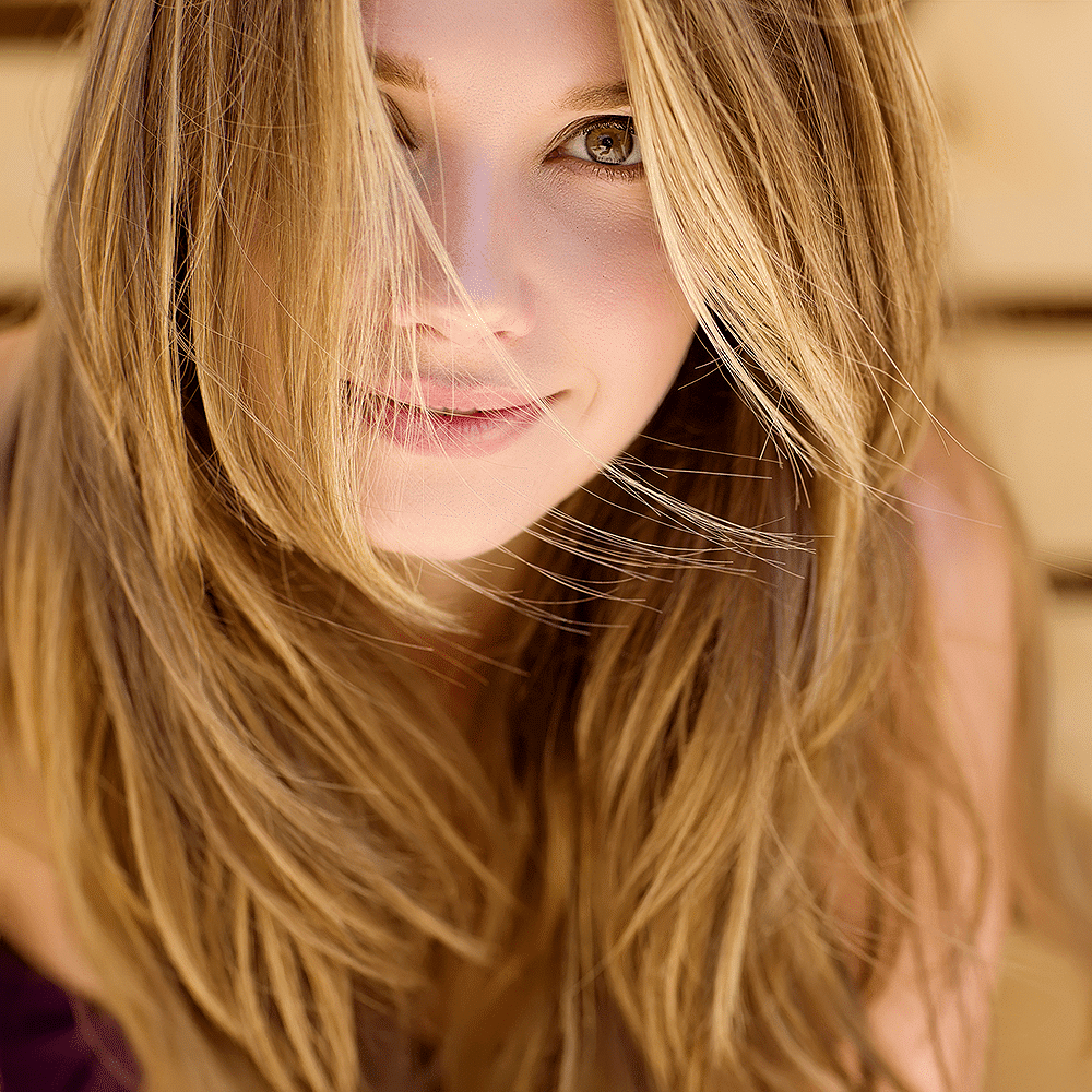 A happy woman with healthy long hair